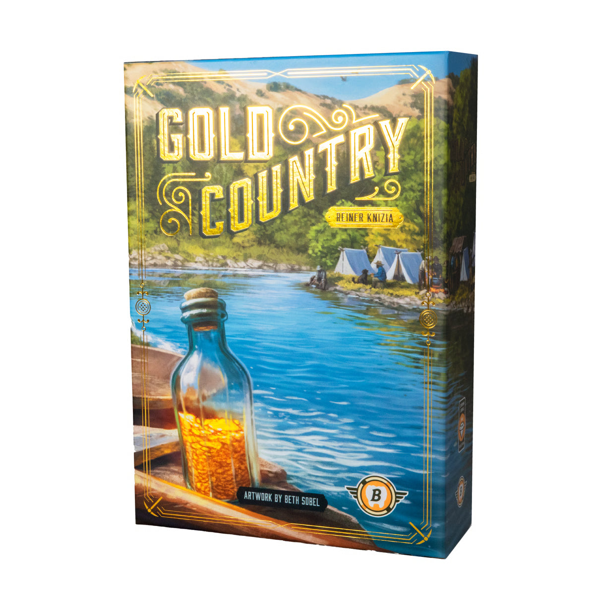 Board game box for Gold Country: A Time of Kindness, featuring a scenic illustration of a river campsite with tents, mountains, and a glass bottle filled with gold in the foreground. The box is shown at a three-quarter angle on a plain white background.