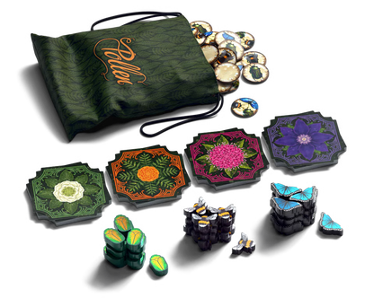 A board game set displayed on a white background, including a dark green drawstring pouch with gold script, several decorative game tiles with floral and geometric designs, butterfly pieces, coin-like tokens, and small accessory pieces.