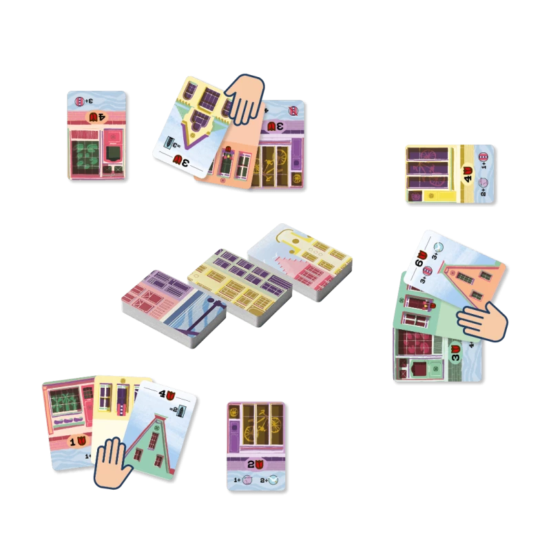 Colorful card game pieces with house designs on a white background
