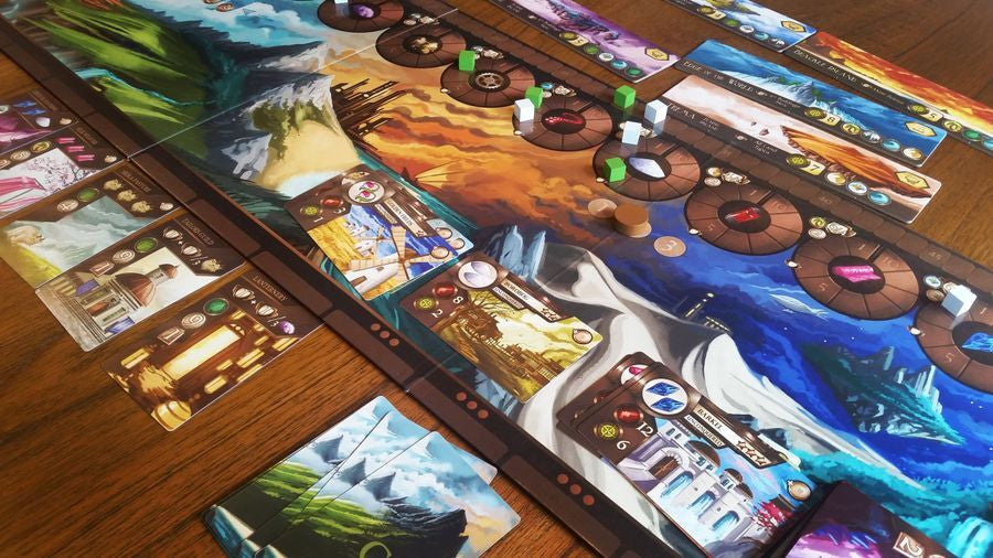 Board game with colorful cards and pieces on a wooden table