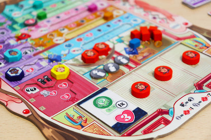 Coming of Age Colorful board game with various tokens and cards on a wooden surface