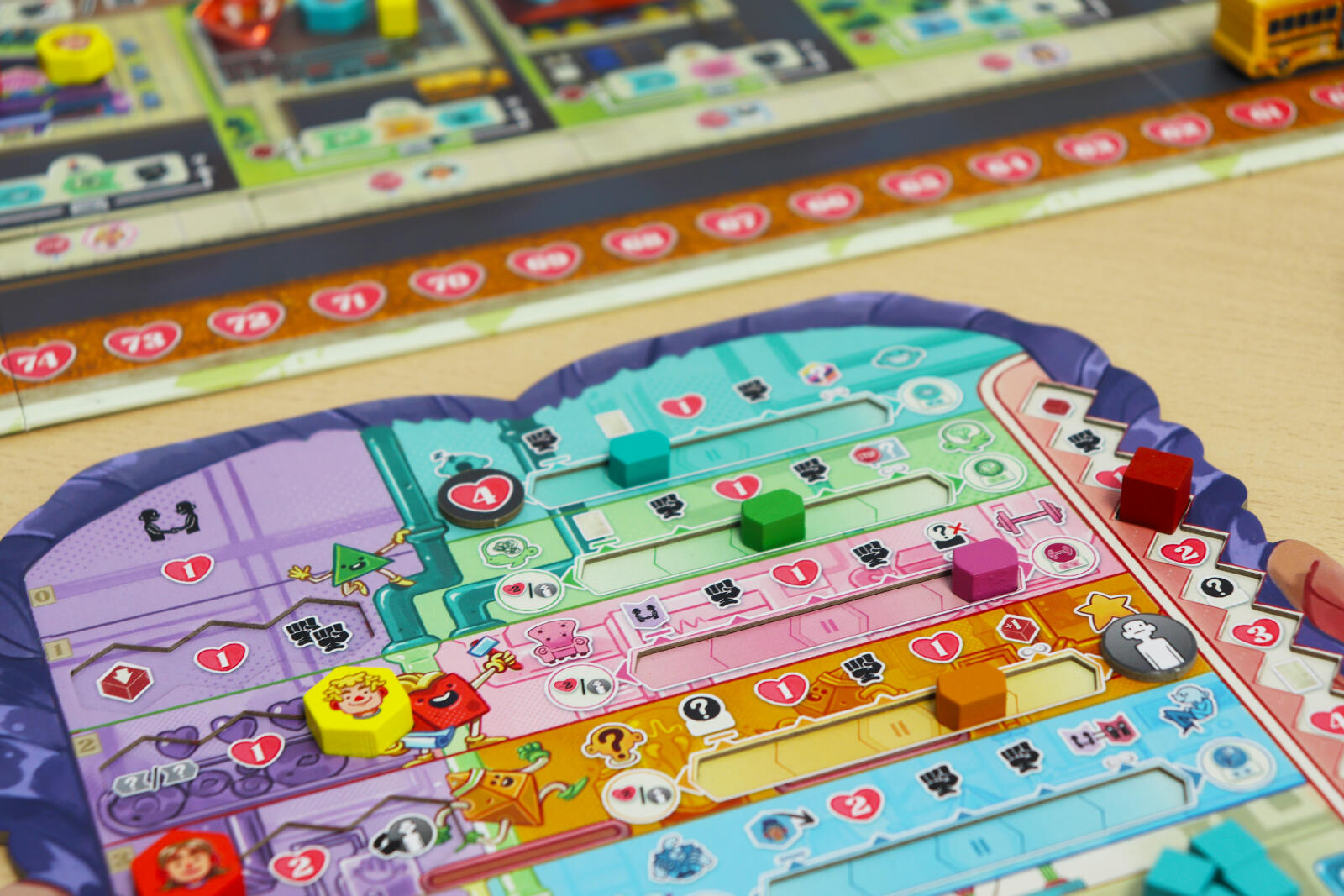 Coming of Age Colorful board game with pieces on a wooden surface