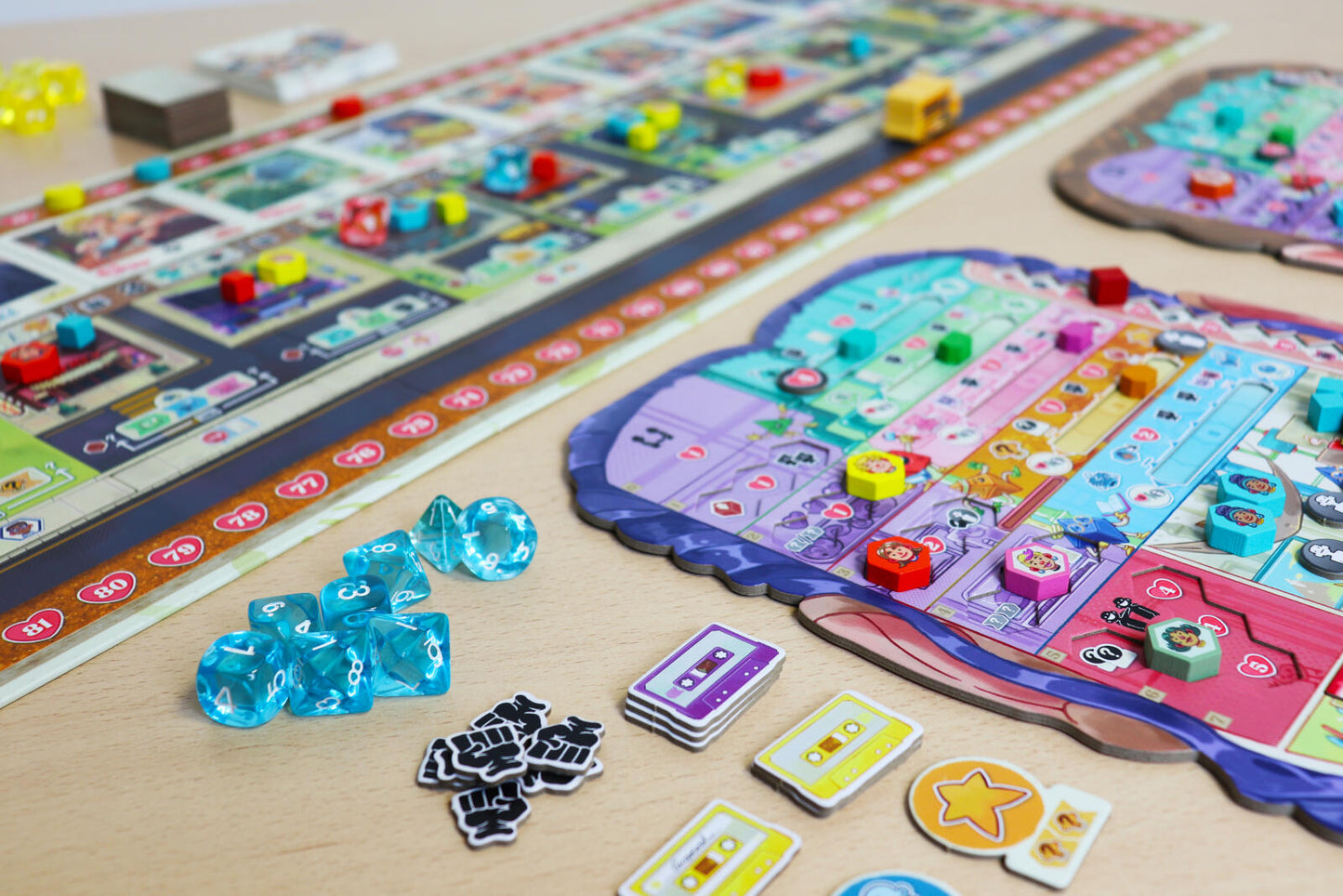 Coming of Age Colorful board game with various pieces on a wooden surface