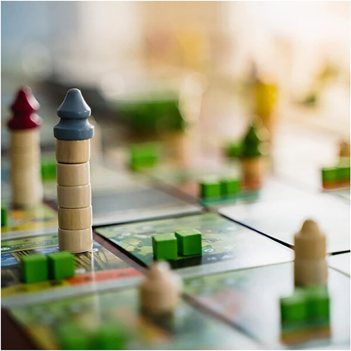 Earth close-up of a board game with wooden and plastic pieces on a blurred background
