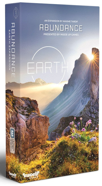 Board game box for 'Abundance Earth' with mountain and nature design