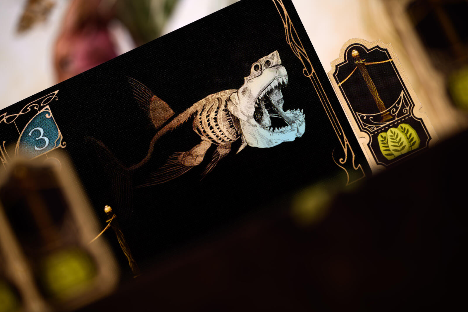Card with a shark design and number 3 on a dark background