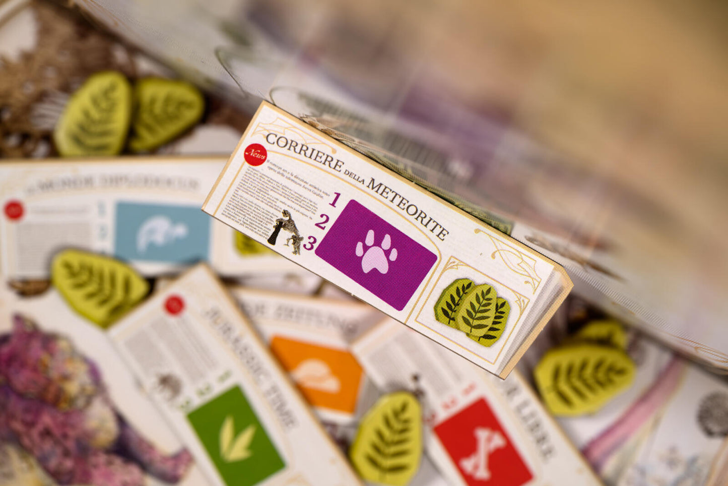 Close-up of a card with 'Corriere della Meteorite' branding among other cards.