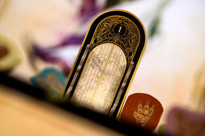 Close-up of a decorative object with intricate designs on a blurred background