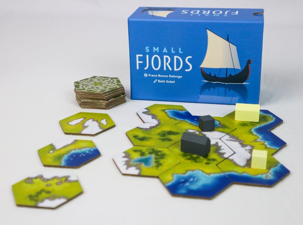 Board game set with 'Small Fjords' packaging on a white background