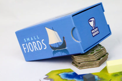 Board game box for 'Small Fjords' with game pieces on a map