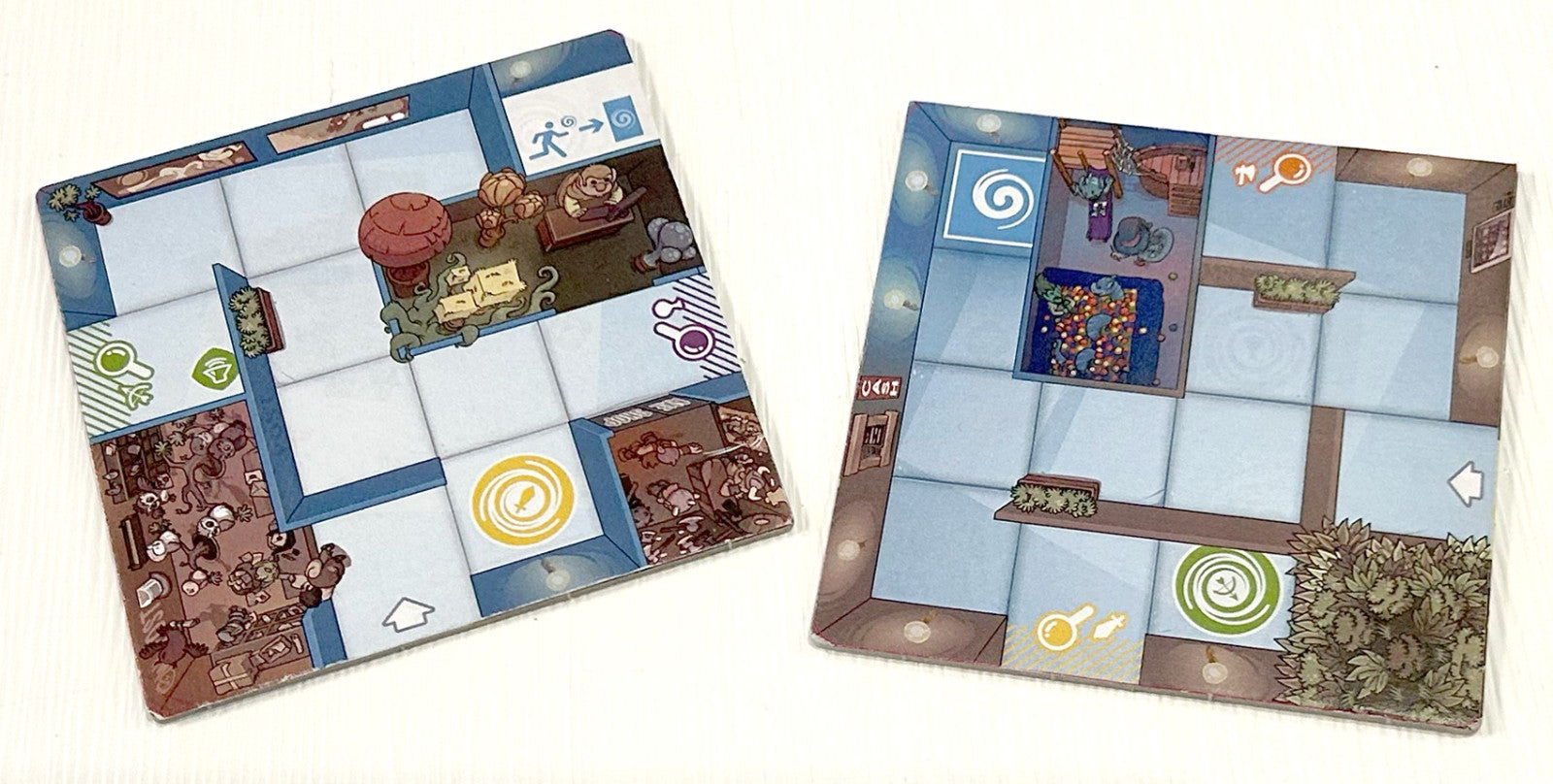 Two board game boards with detailed designs on a white background