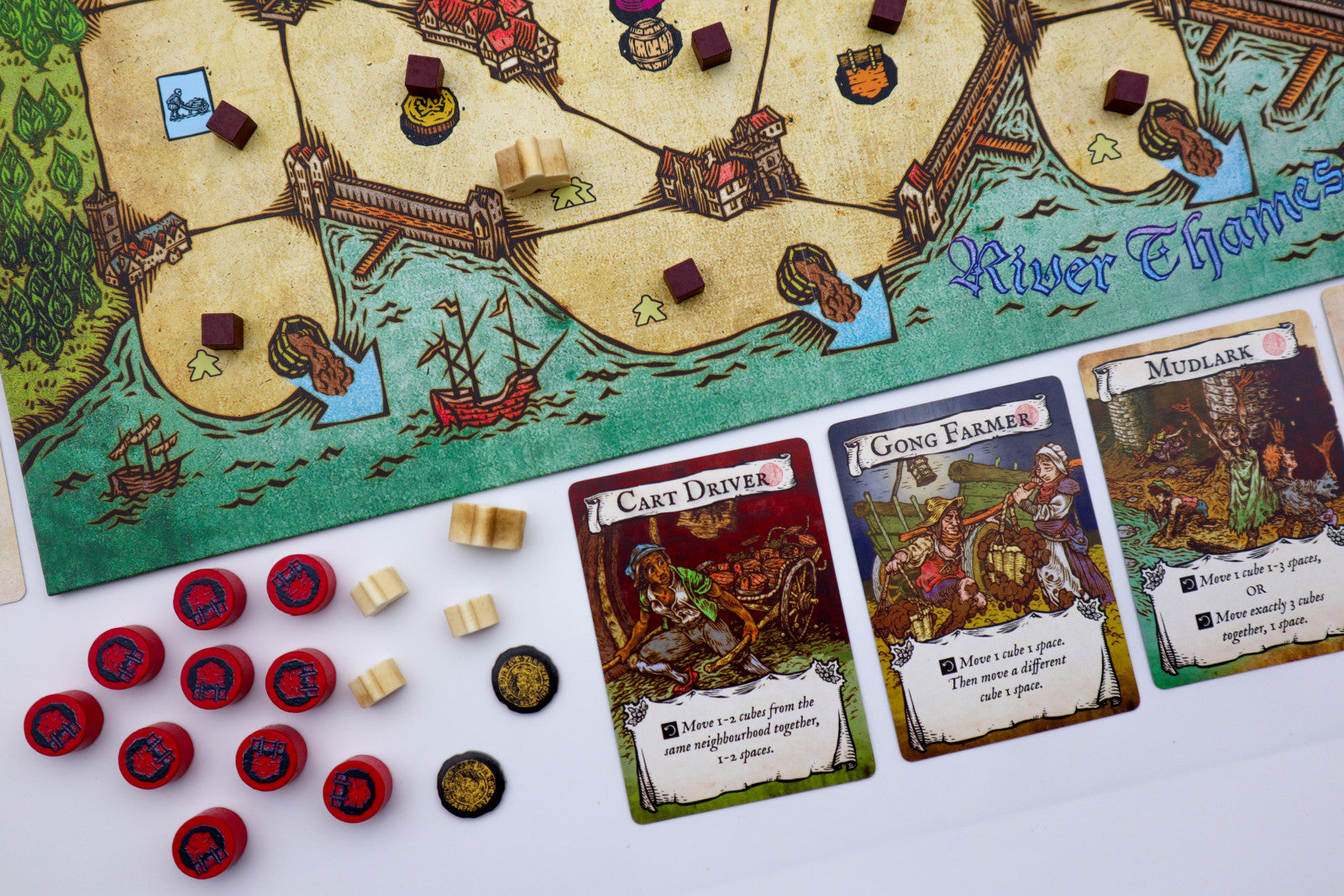 Board game with map, cards, and game pieces on a table