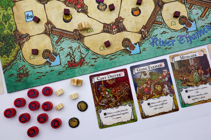 Board game with map, cards, and game pieces on a table