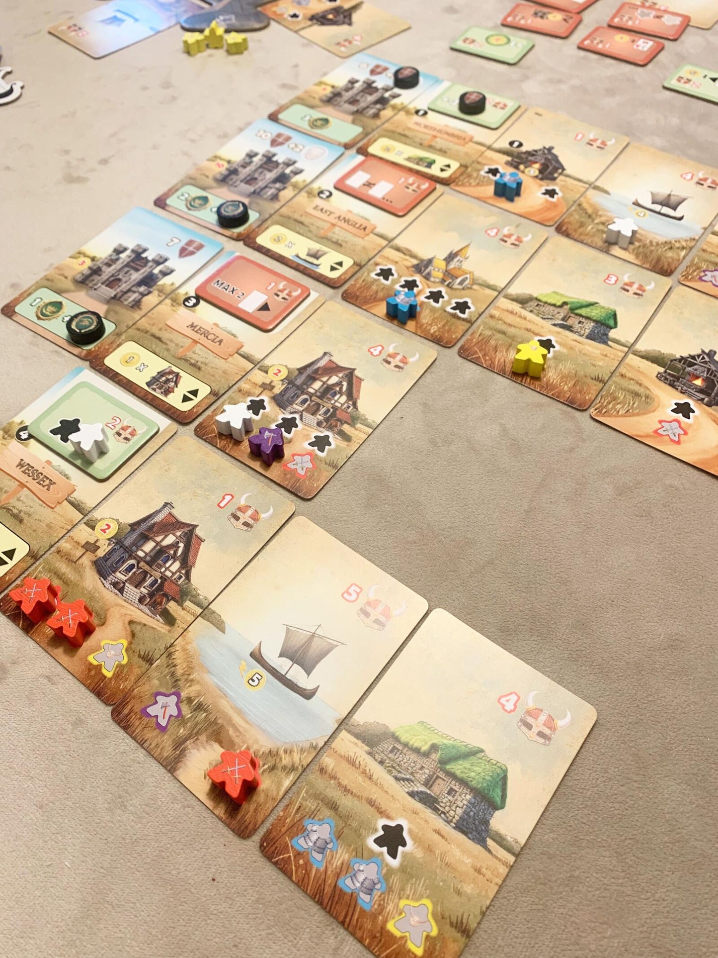 Board game with tiles and pieces on a beige surface