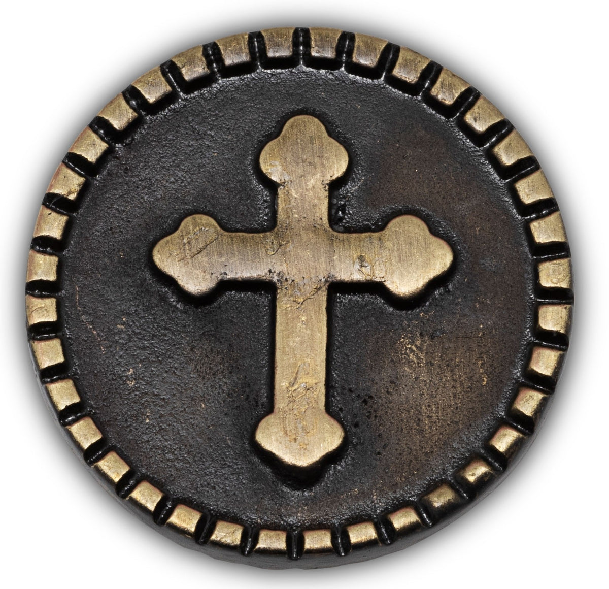 Circular metal coin with a cross symbol and decorative border on a white background