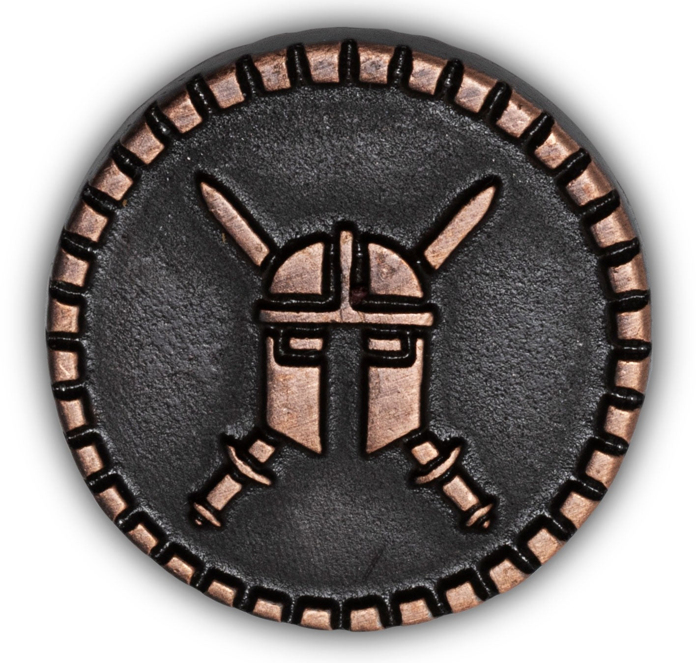 Circular metal token with a helmet design on a white background