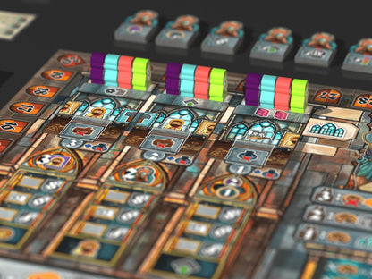Board game tiles with colorful markers on a dark surface