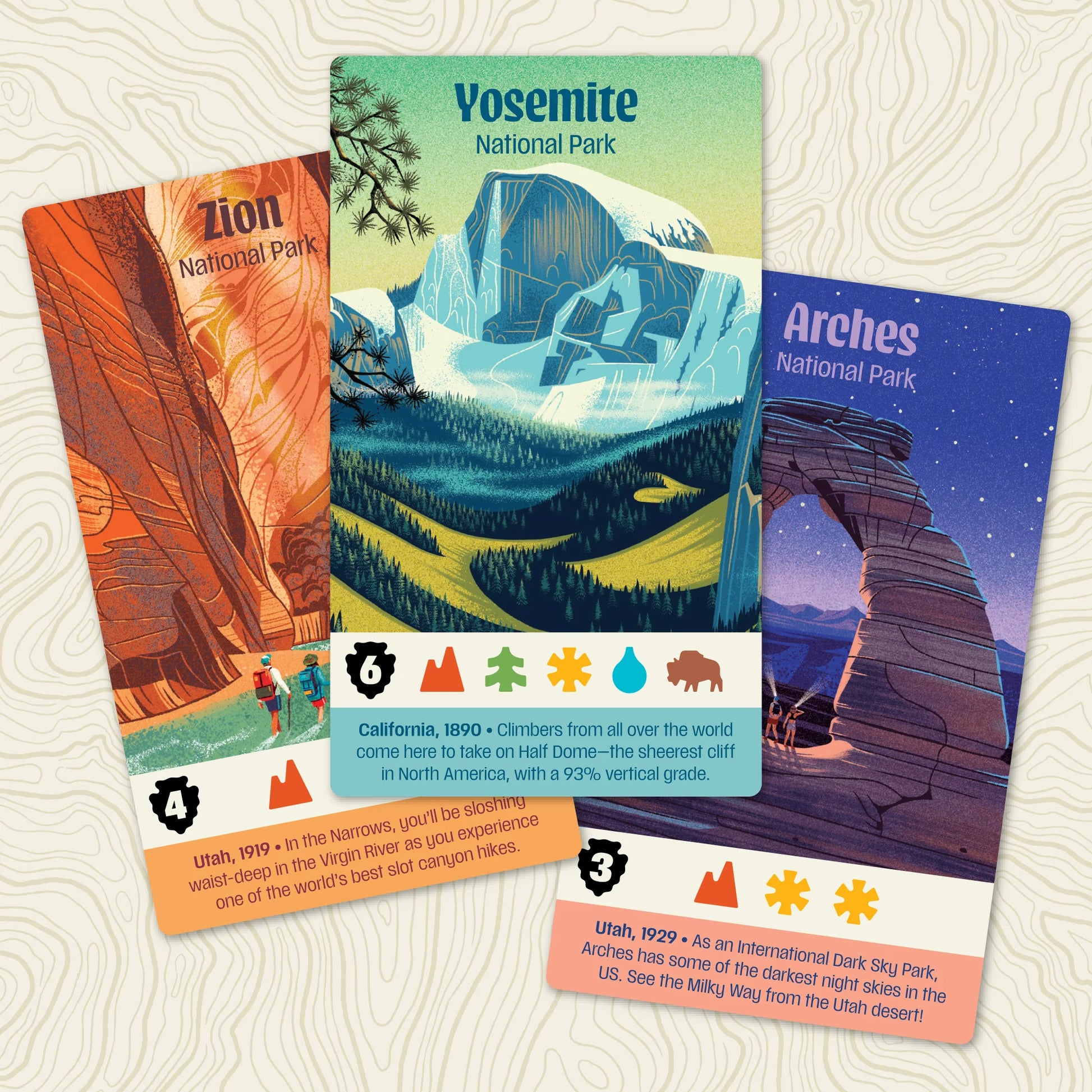 Parks Board Game Three National Park-themed cards on a textured surface