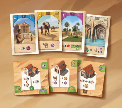 Resafa illustrated trading card faces arranged above four corresponding game boards on a warm beige background. The cards show scenes with a temple, camels in a desert, a green landscape with palm trees, and an aqueduct.