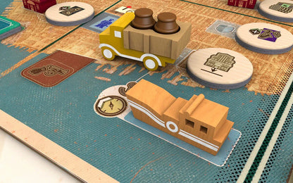 Speakeasy Board game setup with wooden vehicles and round cards on a map