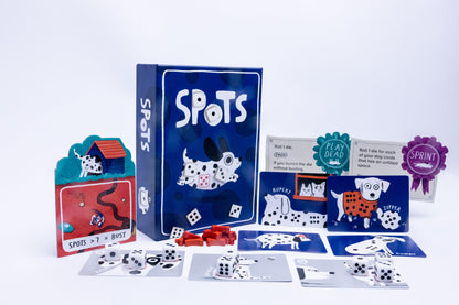 Spots card game set with game cards, dice, and packaging on a white background
