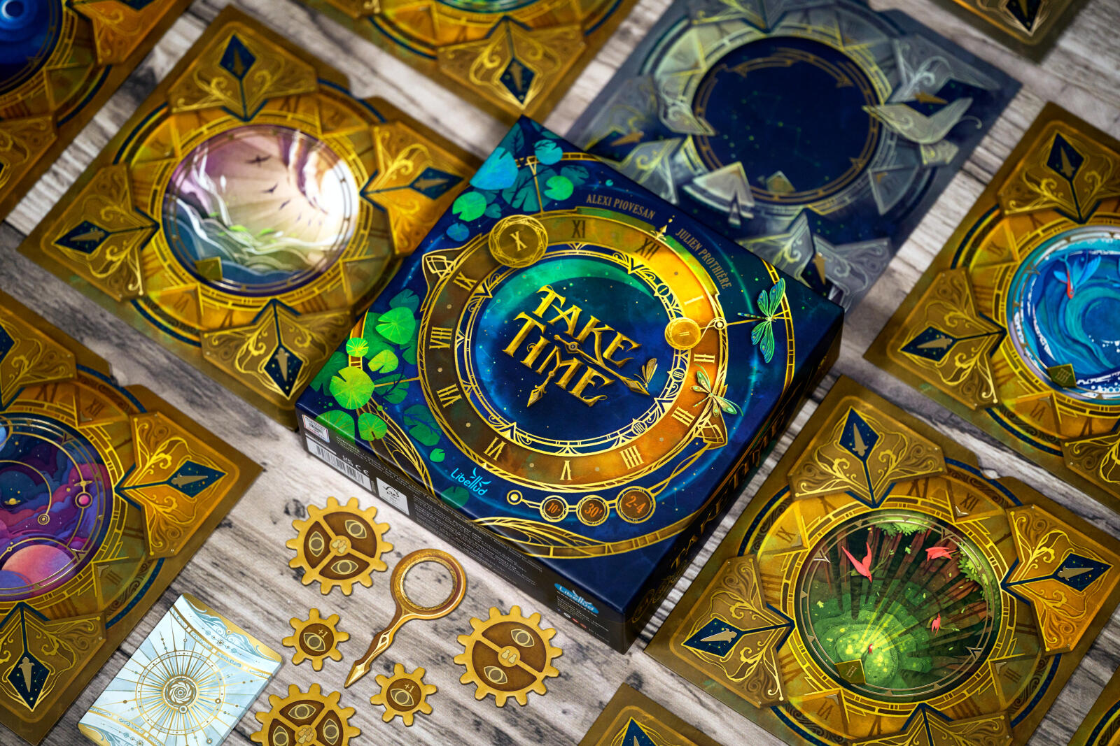 Take Time board game with Decorative box with 'Take Time' text surrounded by ornate cards on a textured surface