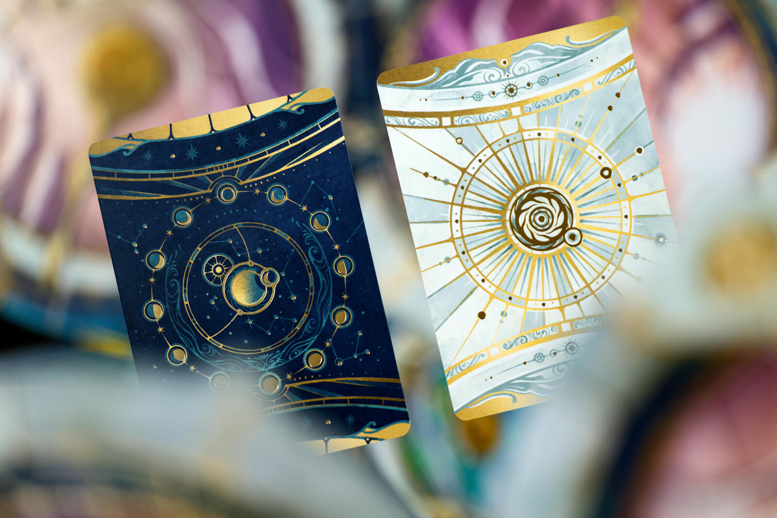 Take Time board game with Two tarot cards with celestial designs held by a hand against a blurred background.