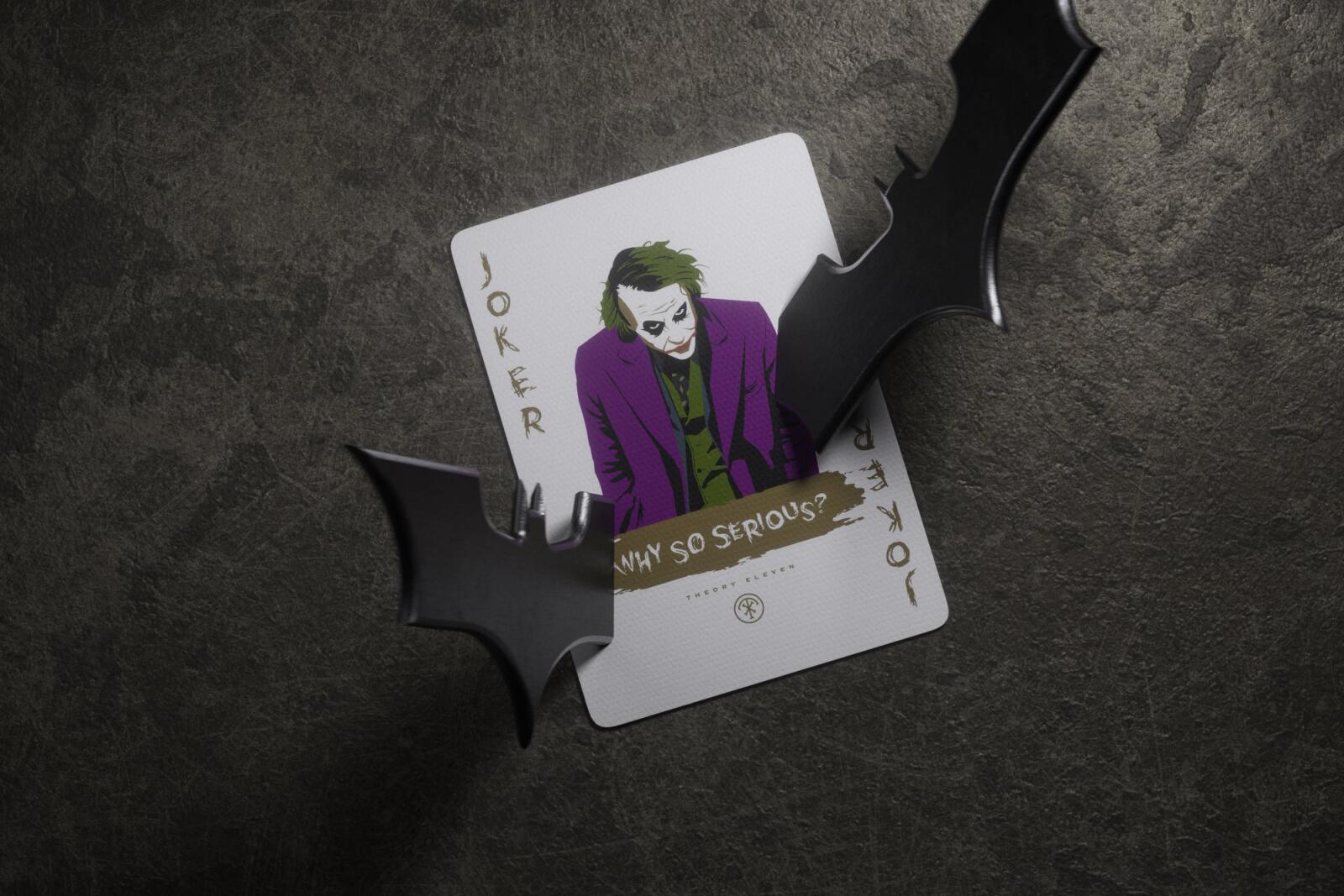 Batman playing cards of the Joker on a dark textured background