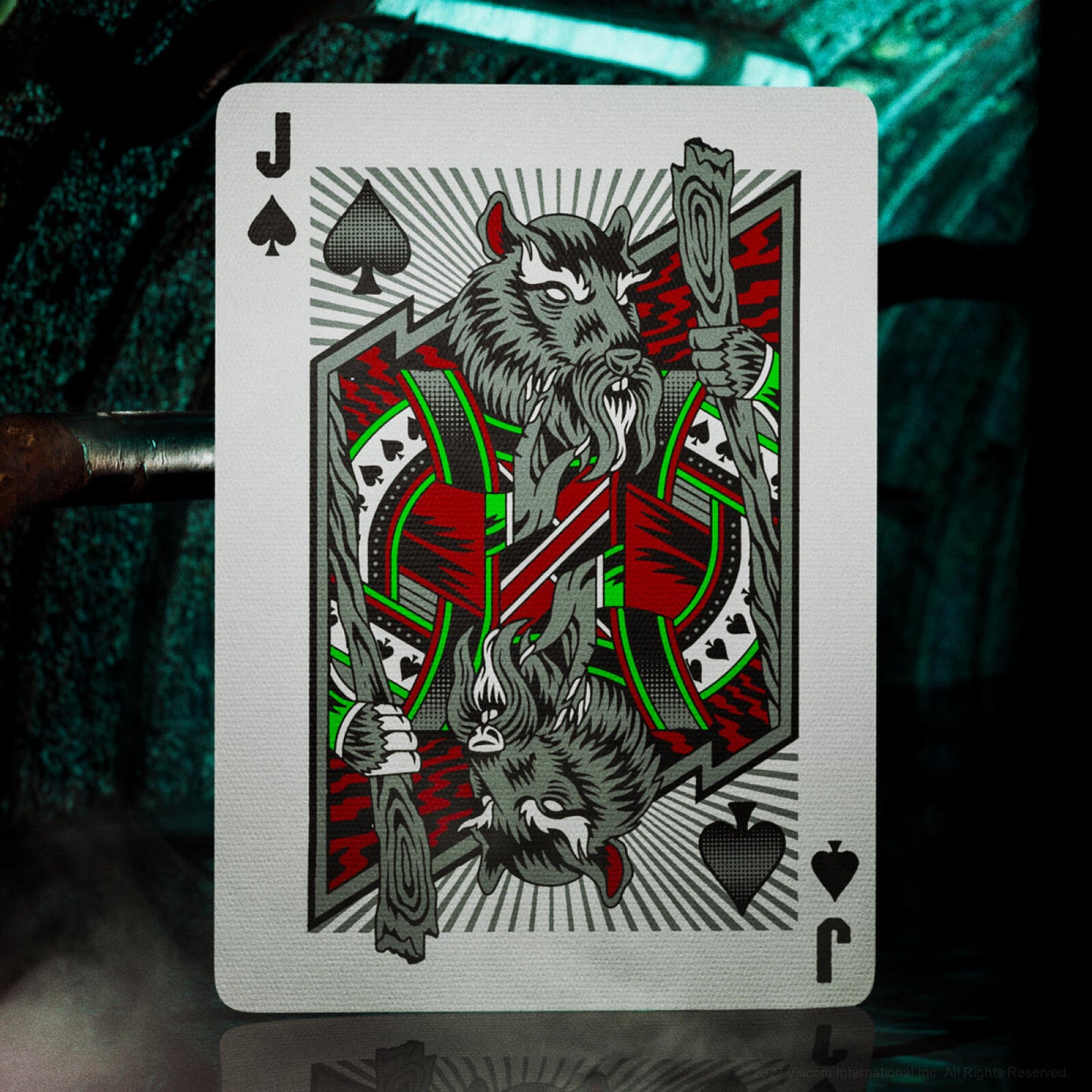 Playing card with a design of a wolf and a spear on a dark background