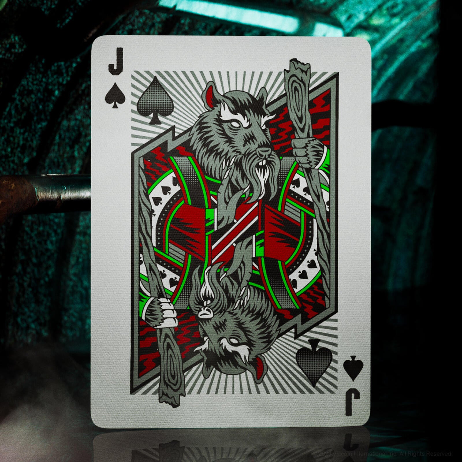 Playing card with a design of a wolf and a spear on a dark background