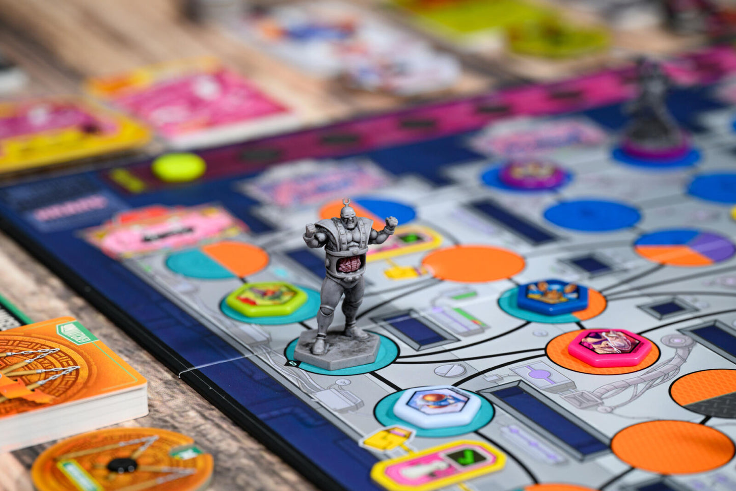 Teenage Mutant Ninja Turtles Board game with colorful tiles and a character figure on a wooden surface